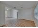 Bright open living room featuring durable wood-look flooring and lots of natural light at 746 Masterpiece Dr, Sun City Center, FL 33573