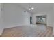 Spacious living room with vaulted ceiling, laminate flooring and recessed lighting, creating a comfortable ambiance at 746 Masterpiece Dr, Sun City Center, FL 33573