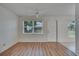 Bright, sunny room with durable laminate floors offering natural light and backyard views at 746 Masterpiece Dr, Sun City Center, FL 33573