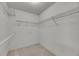 Walk-in closet with white walls, carpet, and wire shelving at 746 Masterpiece Dr, Sun City Center, FL 33573