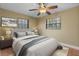 Nicely staged bedroom features a neutral color palette and tile flooring at 819 Gulf Blvd, Indian Rocks Beach, FL 33785