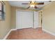 Spacious bedroom features a closet with white louvered doors at 819 Gulf Blvd, Indian Rocks Beach, FL 33785