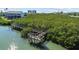 The boardwalk winds through the mangroves, offering a unique experience for nature enthusiasts and photographers alike at 819 Gulf Blvd, Indian Rocks Beach, FL 33785