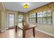 Light-filled dining space featuring large windows and tiled flooring throughout at 819 Gulf Blvd, Indian Rocks Beach, FL 33785