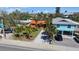 Charming colorful homes with well-manicured yards and palm trees at 819 Gulf Blvd, Indian Rocks Beach, FL 33785