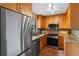 Beautiful kitchen featuring stainless steel appliances, granite countertops, and updated fixtures at 819 Gulf Blvd, Indian Rocks Beach, FL 33785
