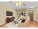 Comfortable living room with a neutral color palette, tile flooring, and a cozy seating area at 819 Gulf Blvd, Indian Rocks Beach, FL 33785