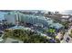Aerial view of a tropical resort with a pool, waterslides, and lush landscaping at 819 Gulf Blvd, Indian Rocks Beach, FL 33785
