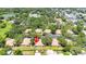 Wide aerial view showing the property surrounded by trees in a lush landscape and a nearby lake at 8436 60Th N St # 304, Pinellas Park, FL 33781