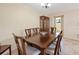 Traditional dining room featuring a wooden table set and china cabinet with natural light at 8436 60Th N St # 304, Pinellas Park, FL 33781