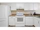 Bright kitchen featuring white cabinetry, sleek appliances, and granite countertops for style and functionality at 8436 60Th N St # 304, Pinellas Park, FL 33781