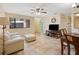 Bright living room featuring tile floors, a ceiling fan, and a comfortable seating arrangement at 8436 60Th N St # 304, Pinellas Park, FL 33781