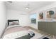 Neutral bedroom featuring a twin bed, modern dresser, and decor with lots of natural light at 8518 Tidal Bay Ln, Tampa, FL 33635