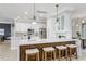 Modern kitchen with an island, quartz countertops, and pendant lighting at 8518 Tidal Bay Ln, Tampa, FL 33635