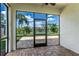 Screened lanai provides serene views of the lake and lush backyard at 8518 Tidal Bay Ln, Tampa, FL 33635