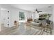 Open living area features bright decor, wood-look floors and lots of light at 8518 Tidal Bay Ln, Tampa, FL 33635