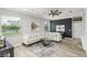 Comfortable living room with a modern rug and a large, inviting sofa at 8518 Tidal Bay Ln, Tampa, FL 33635