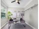 Serene office space with natural light, custom shelves, and modern desk setup at 8518 Tidal Bay Ln, Tampa, FL 33635