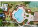 Aerial view of neighborhood swimming pool with ample lounge seating at 8518 Tidal Bay Ln, Tampa, FL 33635