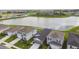 Residential neighborhood featuring single-Gathering homes along a picturesque lake, offering scenic views and community charm at 9577 Sandy Bluffs Cir, Parrish, FL 34219
