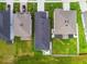 Drone shot showcases rooftops and green yards in a neatly arranged neighborhood setting at 9577 Sandy Bluffs Cir, Parrish, FL 34219