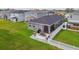 Backyard patio setup with grill, furniture, and privacy fence, perfect for outdoor entertaining at 9577 Sandy Bluffs Cir, Parrish, FL 34219