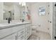 Bright bathroom with double sink vanity, modern fixtures and walk-in shower at 9577 Sandy Bluffs Cir, Parrish, FL 34219