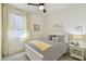 Charming bedroom with a comfy bed, soft natural light, and a peaceful atmosphere, great for rest and relaxation at 9577 Sandy Bluffs Cir, Parrish, FL 34219