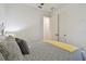 Neat bedroom showcasing ceiling fan, closet doors, and minimalist decor at 9577 Sandy Bluffs Cir, Parrish, FL 34219