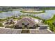 Aerial view of a community center featuring a pool, playground, parking, and landscaped areas at 9577 Sandy Bluffs Cir, Parrish, FL 34219