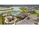 An aerial image of community amenities, including a pool, playground, and ample parking spaces at 9577 Sandy Bluffs Cir, Parrish, FL 34219