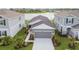 Charming single-Gathering home with a well-kept lawn, landscaping, and a large driveway at 9577 Sandy Bluffs Cir, Parrish, FL 34219
