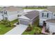 Beautiful single-Gathering home with a well-manicured lawn, landscaping, and a spacious driveway at 9577 Sandy Bluffs Cir, Parrish, FL 34219