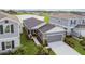Beautiful single-Gathering home with a well-manicured lawn, landscaping, and a spacious driveway at 9577 Sandy Bluffs Cir, Parrish, FL 34219