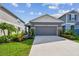Charming single Gathering home with a well-maintained lawn and beautiful landscaping at 9577 Sandy Bluffs Cir, Parrish, FL 34219