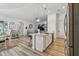 Stylish kitchen with a center island open to a living space with modern stainless appliances and finishes at 9577 Sandy Bluffs Cir, Parrish, FL 34219