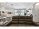Bright open concept living and dining area with modern furnishings and stylish decor at 9577 Sandy Bluffs Cir, Parrish, FL 34219
