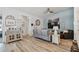 Open-concept living area features a comfortable sofa, stylish furnishings, and bright natural light at 9577 Sandy Bluffs Cir, Parrish, FL 34219