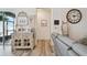 Cozy living room featuring wood-look floors, neutral decor, and stylish furnishings at 9577 Sandy Bluffs Cir, Parrish, FL 34219