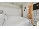 Neutral toned bedroom featuring a door leading into the bright ensuite bathroom at 9577 Sandy Bluffs Cir, Parrish, FL 34219