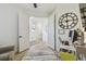 Bright room with a workstation, a large clock and double door entry at 9577 Sandy Bluffs Cir, Parrish, FL 34219