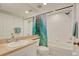 Bathroom featuring a shower-tub combo with a colorful curtain and a single sink vanity at 960 Starkey Rd # 2405, Largo, FL 33771