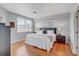 Bright main bedroom with wood floors, large windows, and ceiling fan at 960 Starkey Rd # 2405, Largo, FL 33771