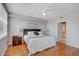 Bright main bedroom with wood floors, ceiling fan, and an ensuite bathroom at 960 Starkey Rd # 2405, Largo, FL 33771