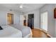 Bright main bedroom with wood floors, ceiling fan, and access to an ensuite bathroom at 960 Starkey Rd # 2405, Largo, FL 33771