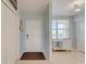 Welcoming condo entry with white doors, tile flooring and a view of the outside at 960 Starkey Rd # 2405, Largo, FL 33771