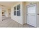 Condo hallway with tiled floors and neutral walls leading to unit 2405 at 960 Starkey Rd # 2405, Largo, FL 33771