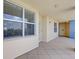 View of a hallway with a tile floor leading to the entrance of a condo at 960 Starkey Rd # 2405, Largo, FL 33771