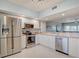 Modern kitchen with stainless steel appliances and white cabinets at 960 Starkey Rd # 2405, Largo, FL 33771