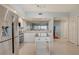 Spacious kitchen with stainless steel appliances, island and an open view to the living area at 960 Starkey Rd # 2405, Largo, FL 33771